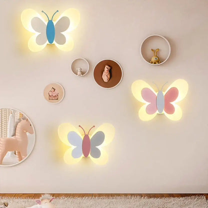 Butterfly LED wall light set with three pastel butterfly silhouettes and warm glow on wall on Tampa Home & Garden Store