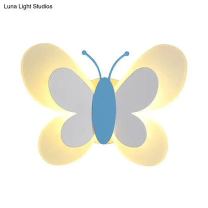 Butterfly LED Wall Light with blue body and gray wings, warm backlit glow by Decorbites on Tampa Home & Garden Store