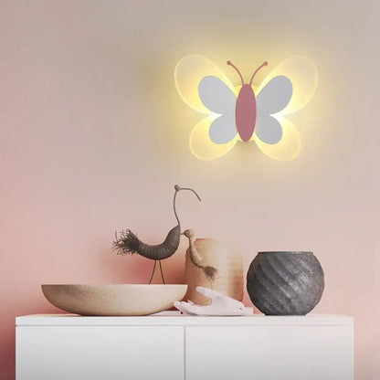 Decorbites Butterfly LED Wall Light with body and lavender wings warm yellow glow above cabinet on Tampa Home & Garden Store