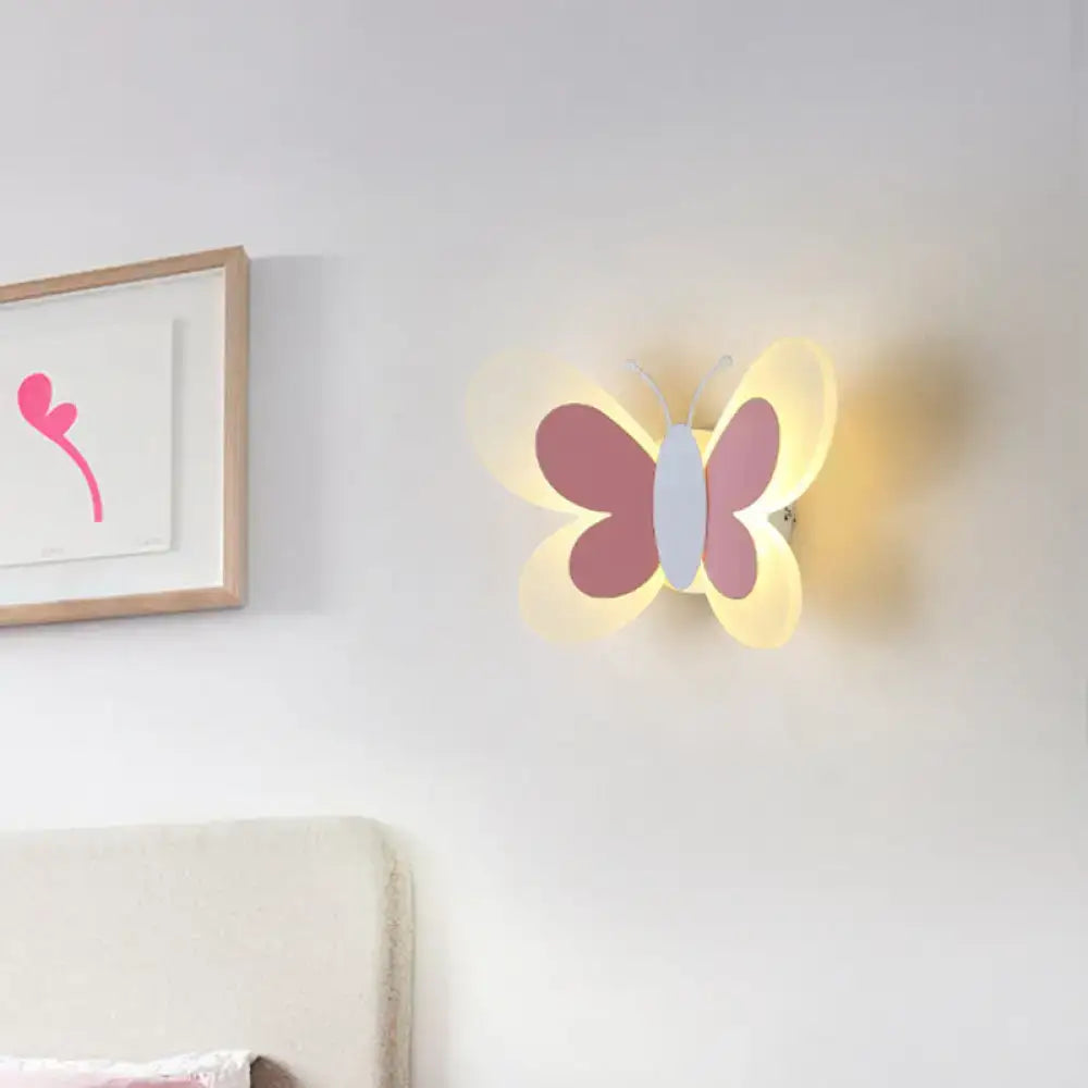 Decorbites Butterfly LED Wall Light with purple wings and pale blue body, warm yellow glow on Tampa Home & Garden Store