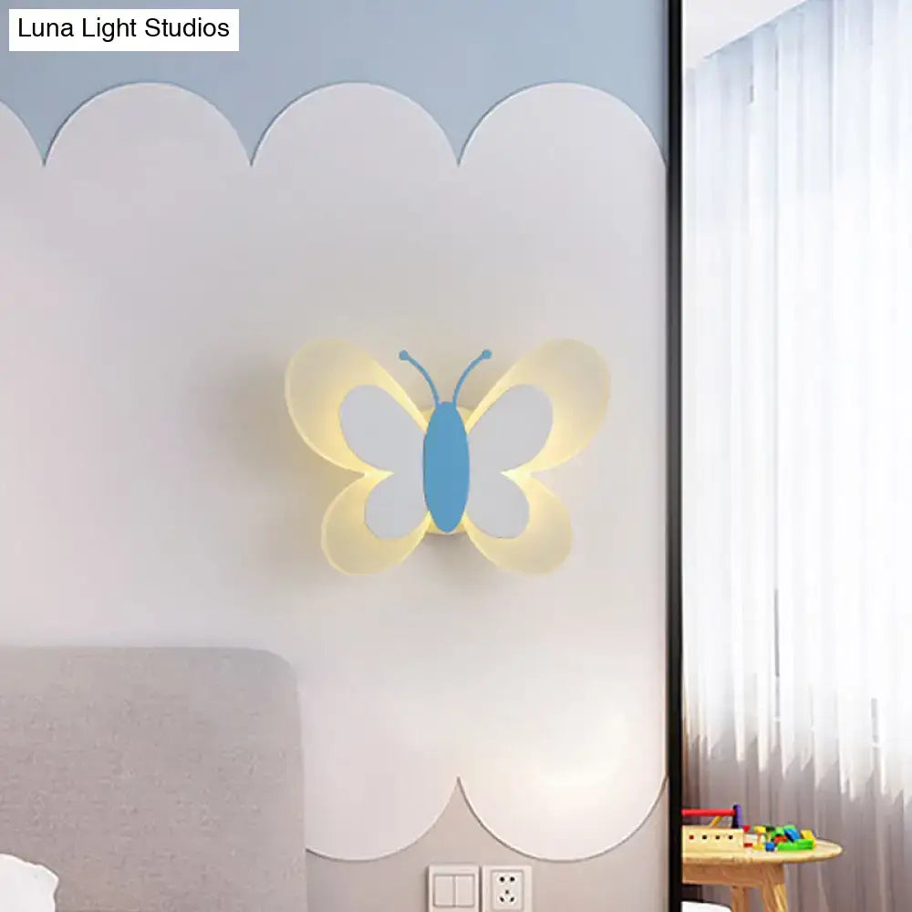 Butterfly LED wall light by Decorbites blue butterfly with yellow wings warm glow on wall on Tampa Home & Garden Store