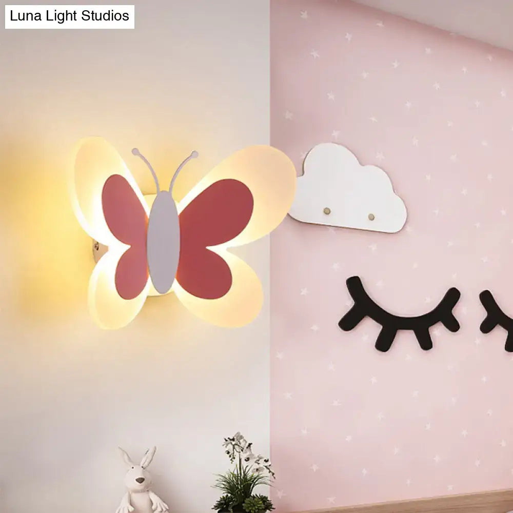 Butterfly LED wall light Decorbites with pink and purple wings and warm glow on Tampa Home & Garden Store