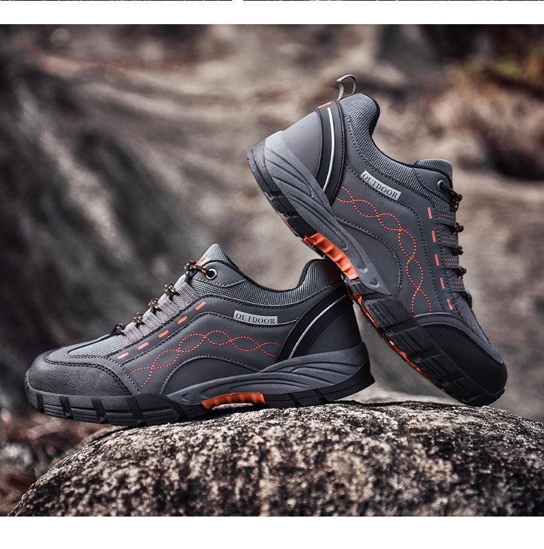 Stevvex mens casual outdoor shoes, dark gray leather-look with orange stitching, pair on Tampa Home & Garden Store