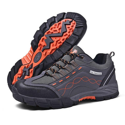 Casual men's outdoor Stevvex athletic shoes, grey with orange accents, low-cut rugged outsole on Tampa Home & Garden Store
