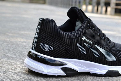 Stevvex men's black athletic sneakers with breathable mesh upper and cushioned sole on Tampa Home & Garden Store