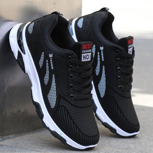 Pair of black mesh athletic sneakers with white sole, cushioned midsole, non-slip grip on Tampa Home & Garden Store