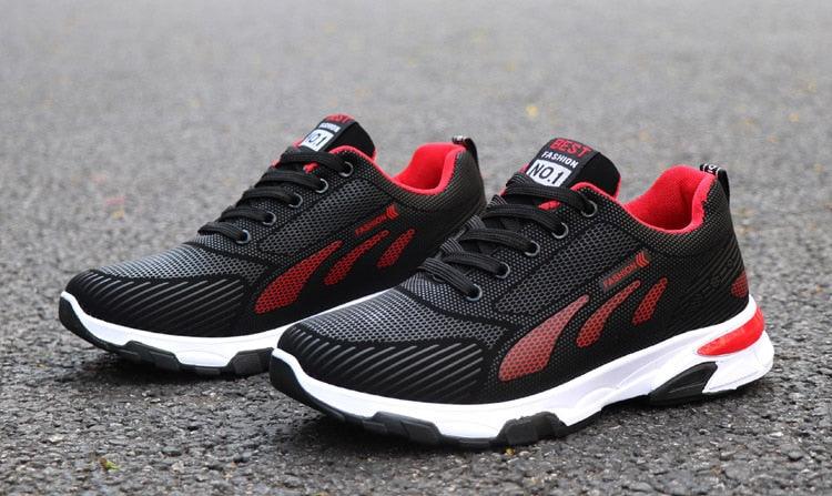 Stevvex athletic sneakers with black mesh upper, red side panels, white cushioned sole on Tampa Home & Garden Store