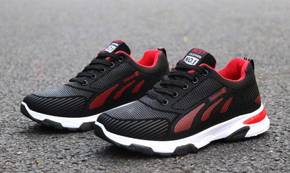Stevvex athletic sneakers with black mesh upper, red side panels, white cushioned sole on Tampa Home & Garden Store