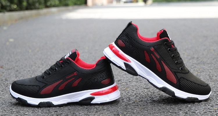 Stevvex sneakers pair, black mesh with red accents, white sole, non-slip shoes for men on Tampa Home & Garden Store