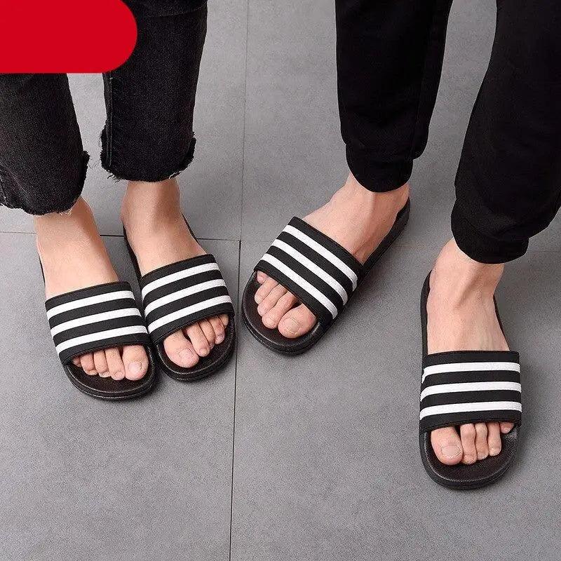 Stevvex striped slide sandals with black straps and white stripes, casual summer footwear on Tampa Home & Garden Store
