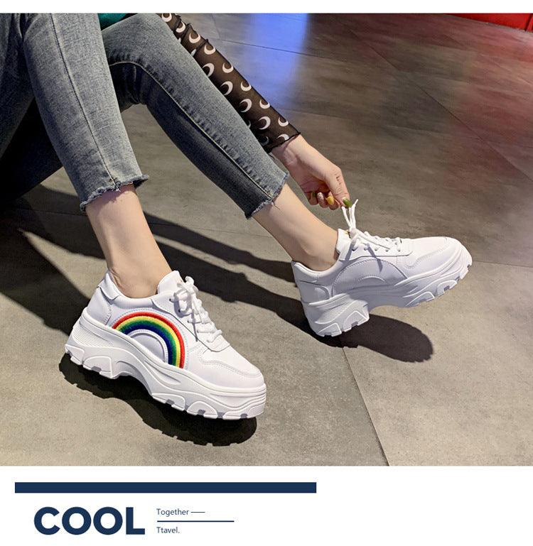 Pair of white platform sneakers with rainbow arch, lace-up, thick sole, Stevvex sneakers on Tampa Home & Garden Store