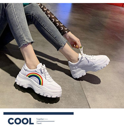 Pair of white platform sneakers with rainbow arch, lace-up, thick sole, Stevvex sneakers on Tampa Home & Garden Store