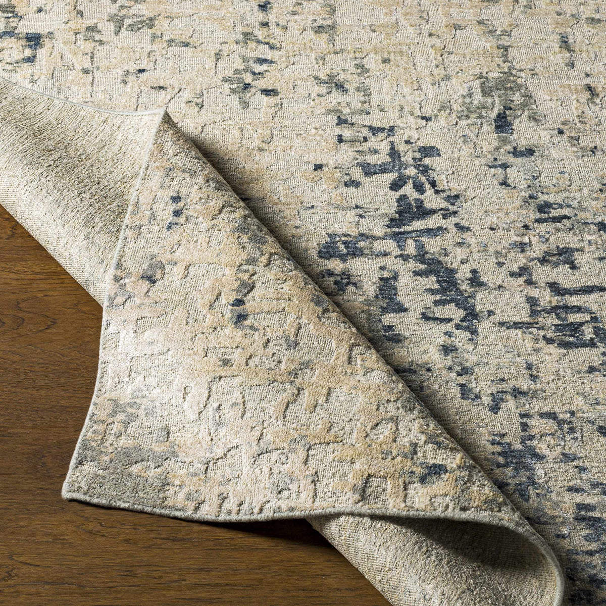 Cayuga area rug beige ivory with navy accents, distressed abstract pattern by Boutique Rugs on Tampa Home & Garden Store
