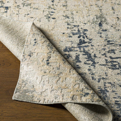 Cayuga area rug beige ivory with navy accents, distressed abstract pattern by Boutique Rugs on Tampa Home & Garden Store