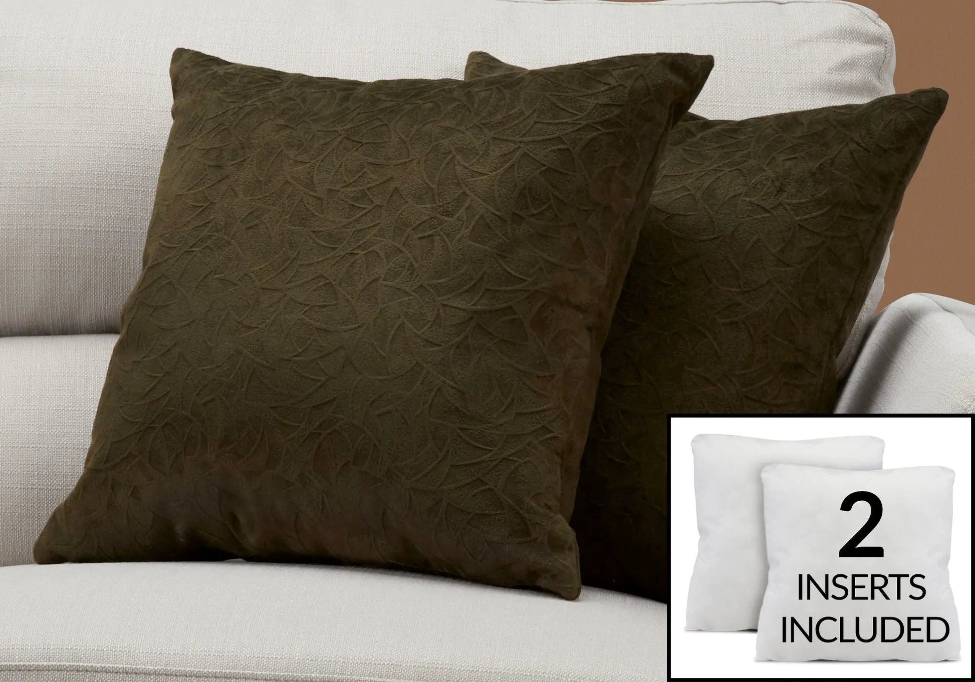 Two brown square throw pillows with embossed curved pattern; includes inserts on light beige sofa on Tampa Home & Garden Store