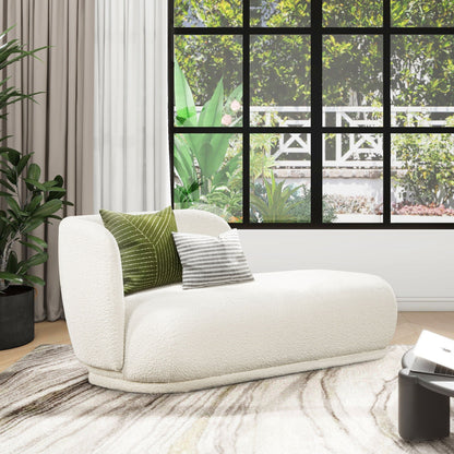 Ivory white rounded chaise lounge with faux sheepskin upholstery and two decorative pillows on Tampa Home & Garden Store