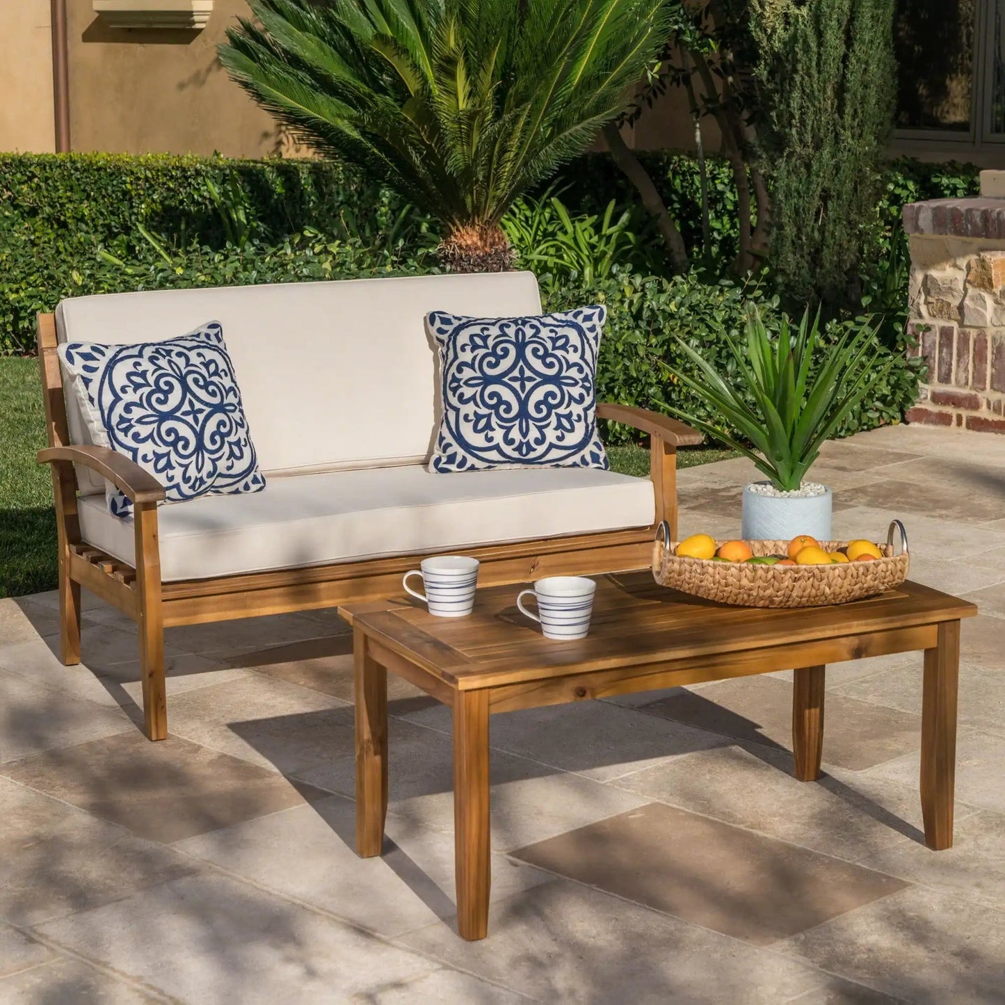 Outdoor chat set with coffee table and loveseat, 2-piece, wood frame beige cushions on Tampa Home & Garden Store