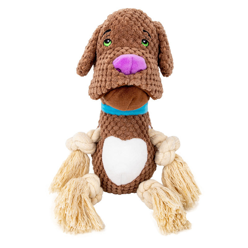 Dog plush toy with rope legs, brown fur, white heart chest, purple nose, green eyes on Tampa Home & Garden Store