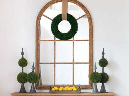 Arched mirror in distressed brown fir wood frame with green wreath and burlap strap on Tampa Home & Garden Store
