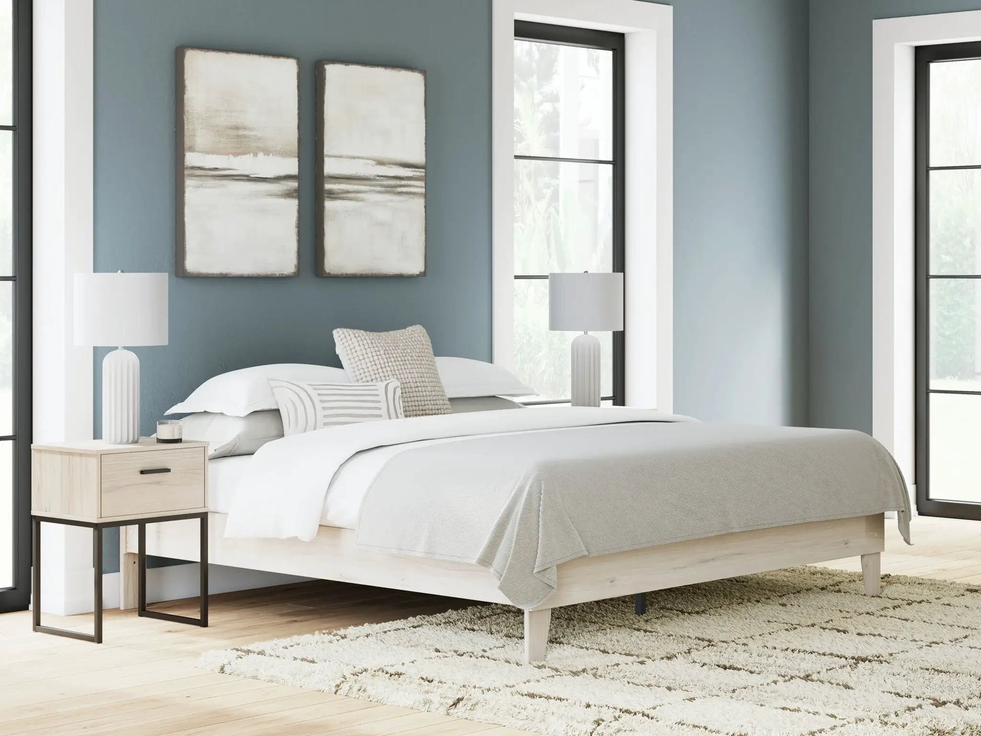 Socalle Platform Bed with light wood frame and black metal legs in a blue-gray bedroom on Tampa Home & Garden Store