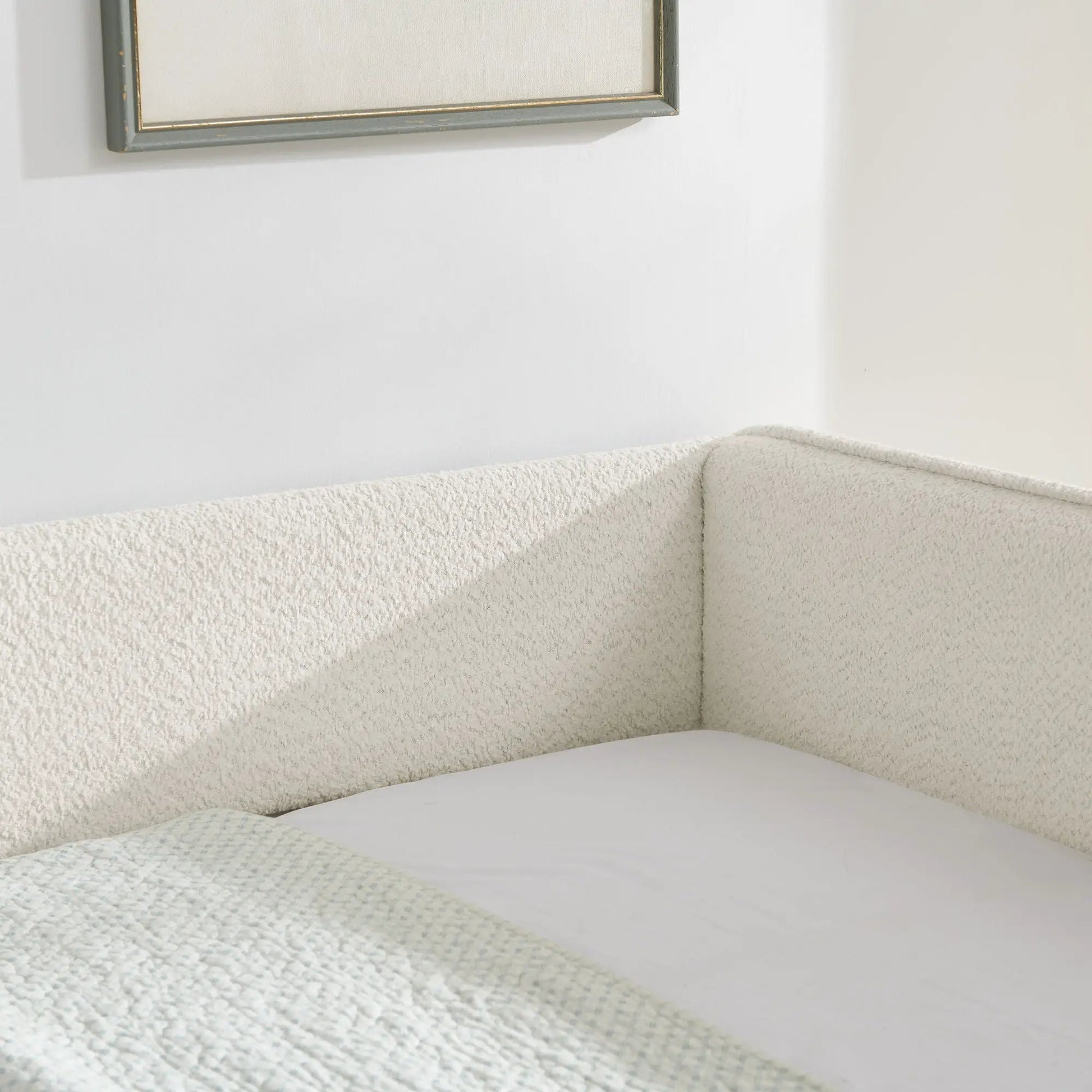 Upholstered daybed with pop up trundle in beige textured fabric, corner view on Tampa Home & Garden Store