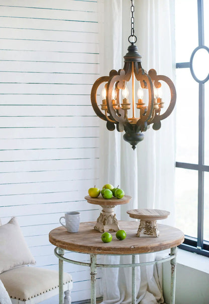 Cake Stand with magnesium base in cream brown, round wooden top on weathered table with apples on Tampa Home & Garden Store