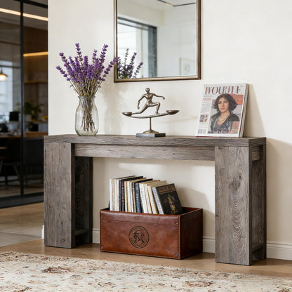 Wood entryway console table in weathered gray finish with lavender vase and metal sculpture on Tampa Home & Garden Store