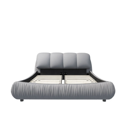 Luxury upholstered platform bed with oversized padded gray backrest and solid wood frame on Tampa Home & Garden Store