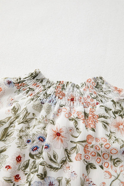 Floral printed smocked-neck long sleeve mini dress Stevvex with green leaves and peach blooms on Tampa Home & Garden Store