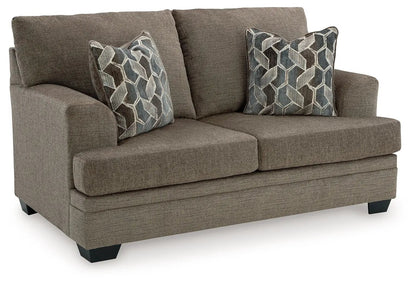 Stonemeade living room set in taupe with blue geometric pillows by Unique Piece Furniture on Tampa Home & Garden Store