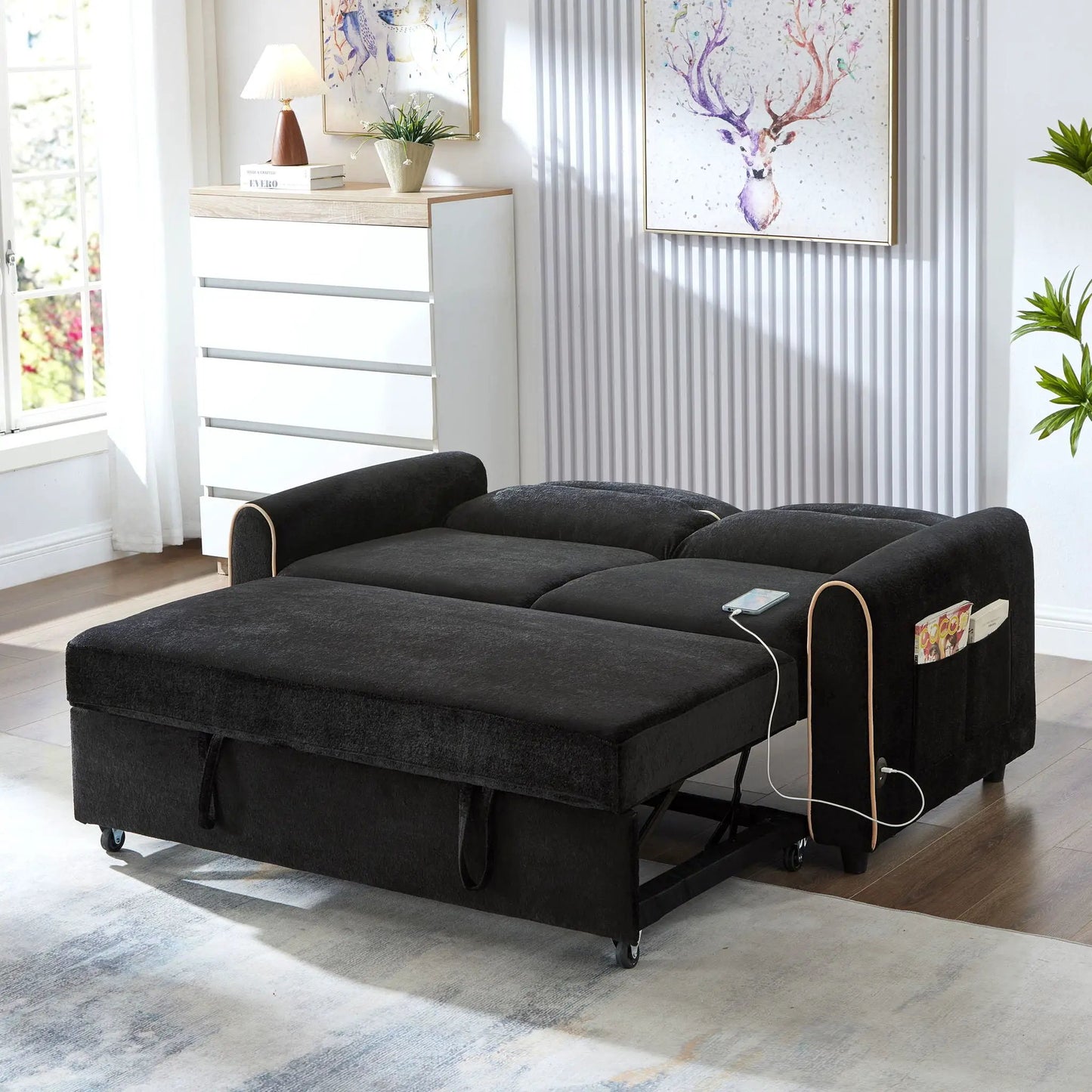 Pull-out sleeper loveseat in black fabric with adjustable backrest and USB ports in living room on Tampa Home & Garden Store