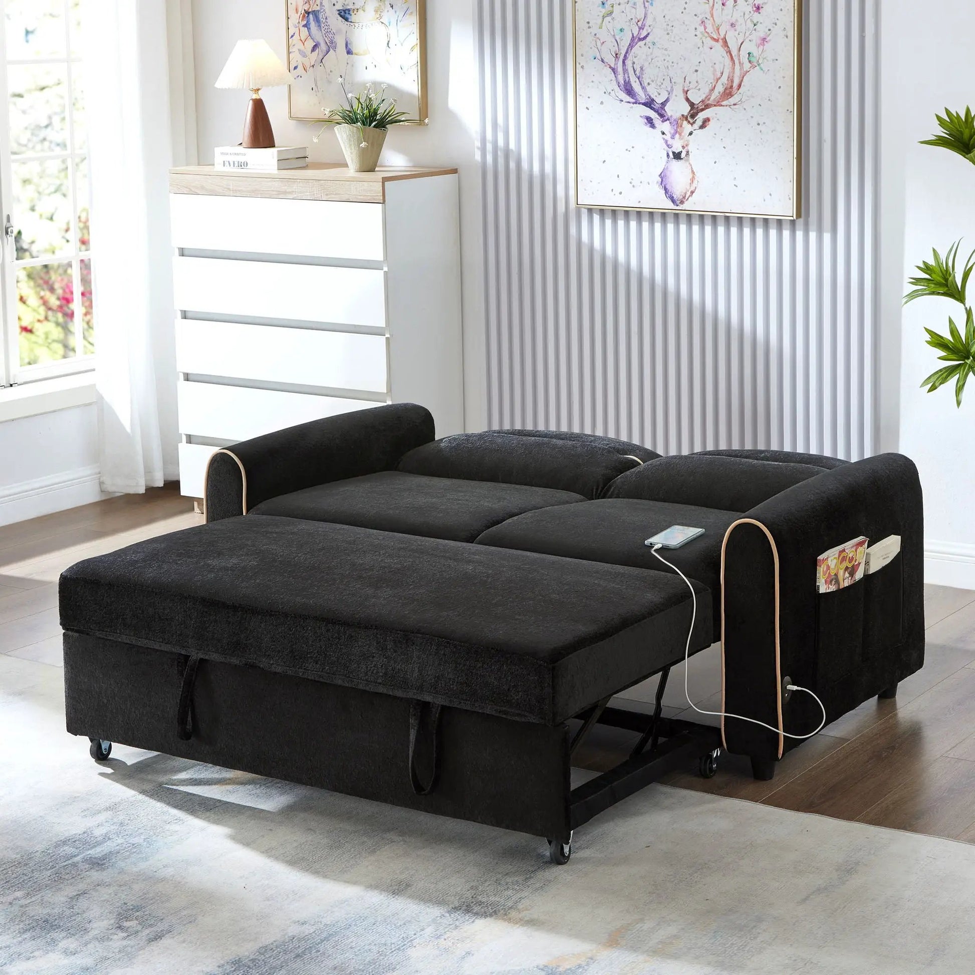 Pull-out sleeper loveseat in black fabric with adjustable backrest and USB ports in living room on Tampa Home & Garden Store