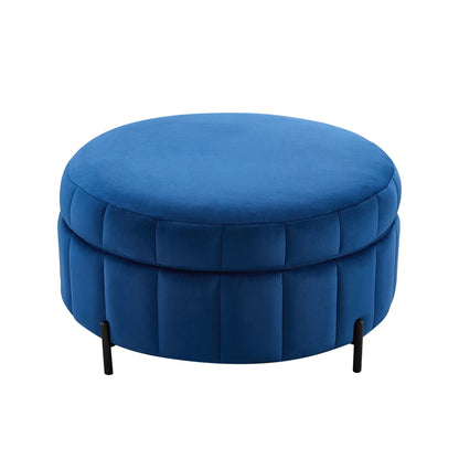 Upholstered blue round storage ottoman with channel tufting and black metal legs on Tampa Home & Garden Store