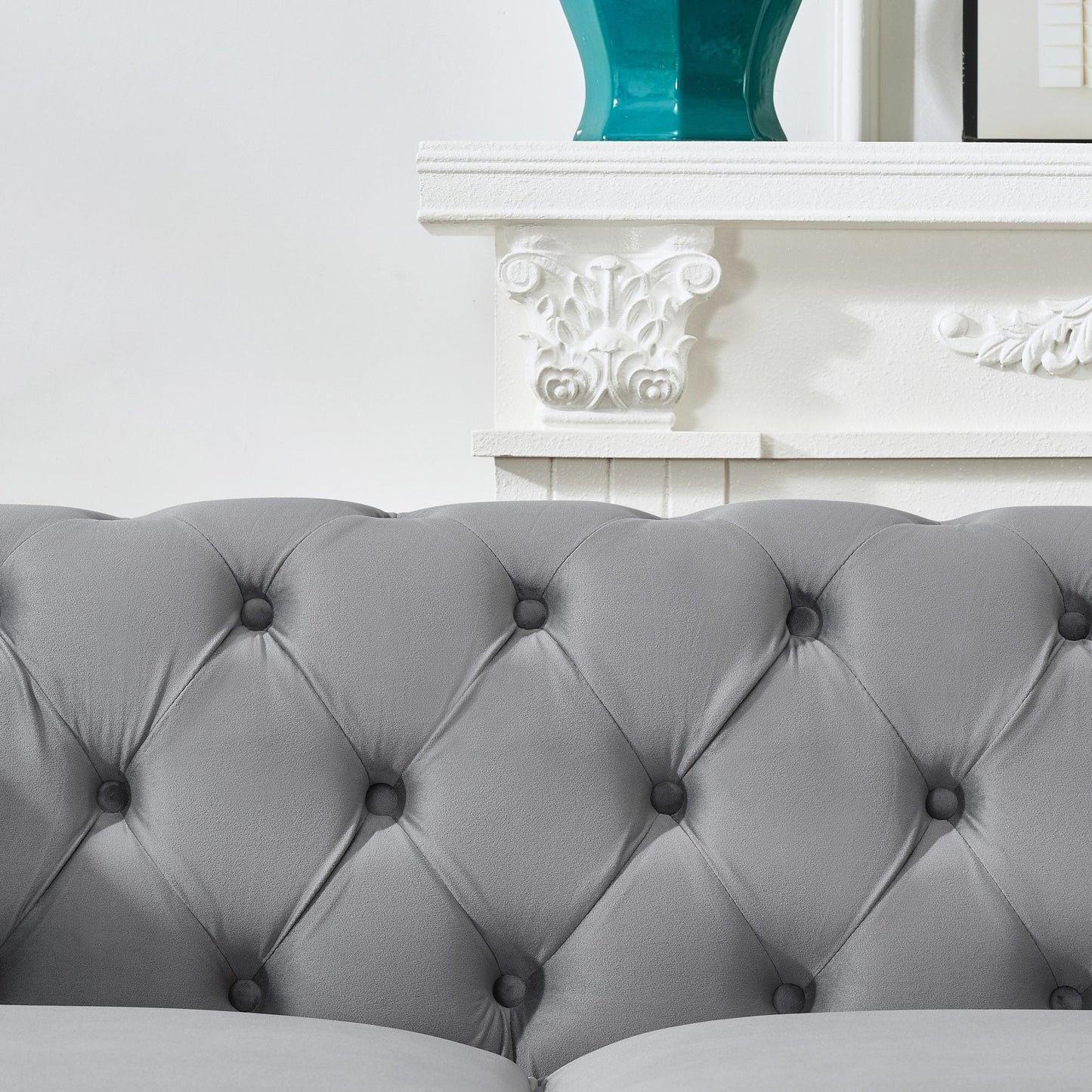Chesterfield upholstery fabric sofa with grey tufted cushions and button-tack detailing on Tampa Home & Garden Store