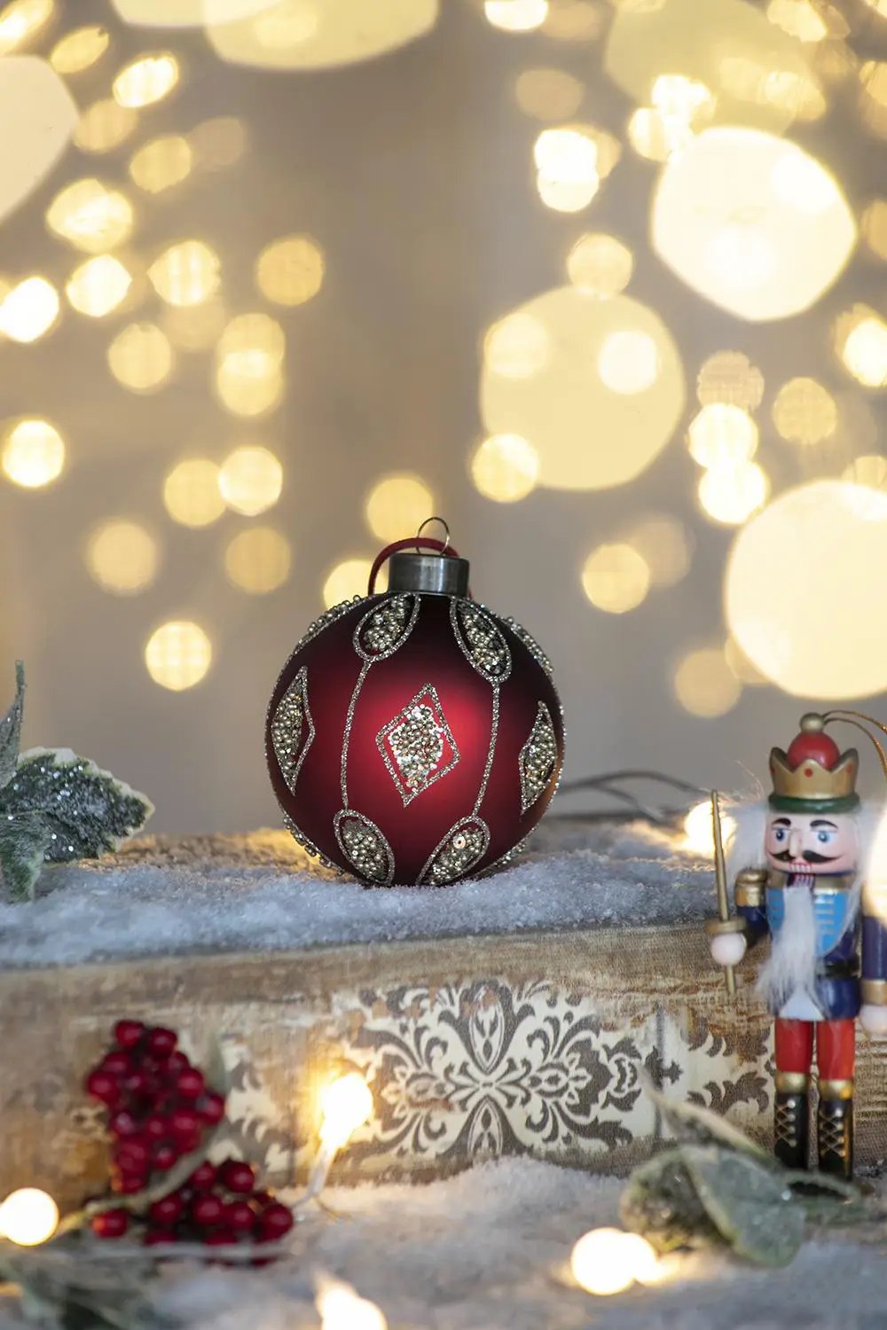 Decorative Christmas ball ornament in maroon with silver rhinestone pattern on Tampa Home & Garden Store