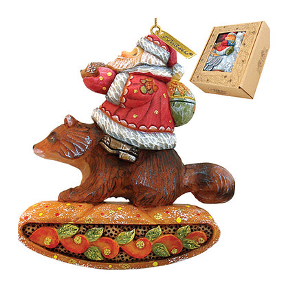 Santa on raccoon sculpted hand-painted ornament, red coat with white trim, G. DeBrekht on Tampa Home & Garden Store