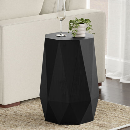 Solid acacia wood side table with sculpted faceted form in black finish beside sofa on Tampa Home & Garden Store