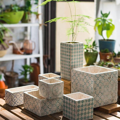 Cement planters set of 3 in blue patterns, assorted shapes on a wooden surface on Tampa Home & Garden Store