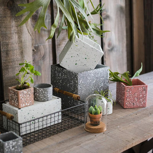Cement planters by RusticReach in varied shapes and colors, pink gray speckled blocks on Tampa Home & Garden Store