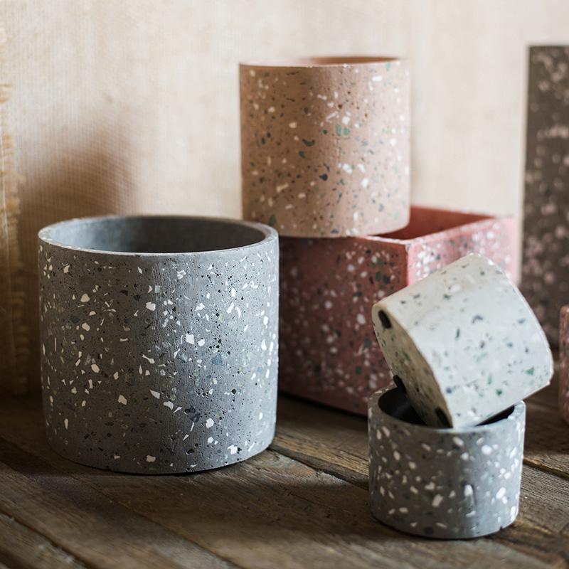 RusticReach terrazzo cement planters: gray cylindrical pots with white flecks and tan/pink hues on Tampa Home & Garden Store