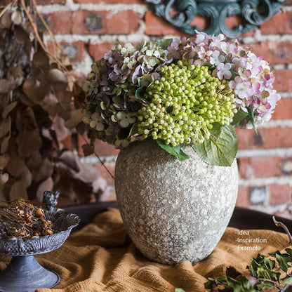 Cement Pompeii-style handmade art jar pot with green and lilac hydrangea bouquet on Tampa Home & Garden Store