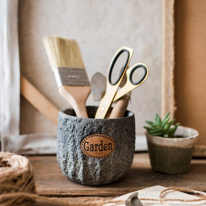 RusticReach cement stone tiny garden planter with leather patch beside brushes and scissors on Tampa Home & Garden Store