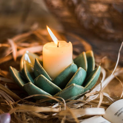 Ceramic Floral Candle Holder with teal petals and lit ivory candle on Tampa Home & Garden Store