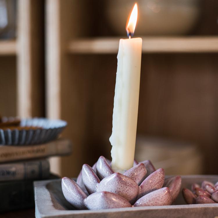 Ceramic Floral Candle Holder with a tall ivory candle on a lavender petal base by RusticReach on Tampa Home & Garden Store
