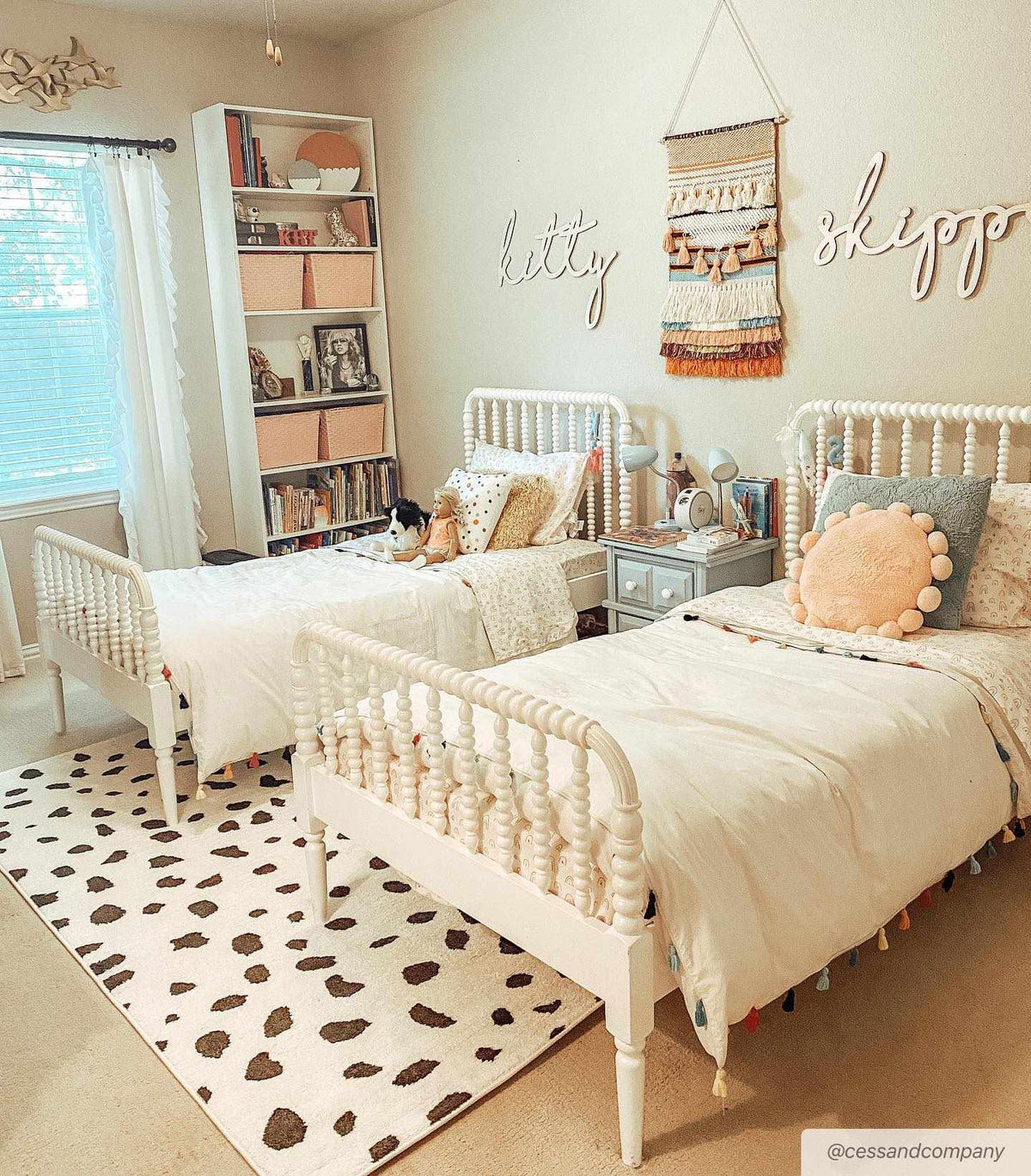 Tariffville Dalmatian Rug by Boutique Rugs; white with brown spots in a twin bedroom on Tampa Home & Garden Store