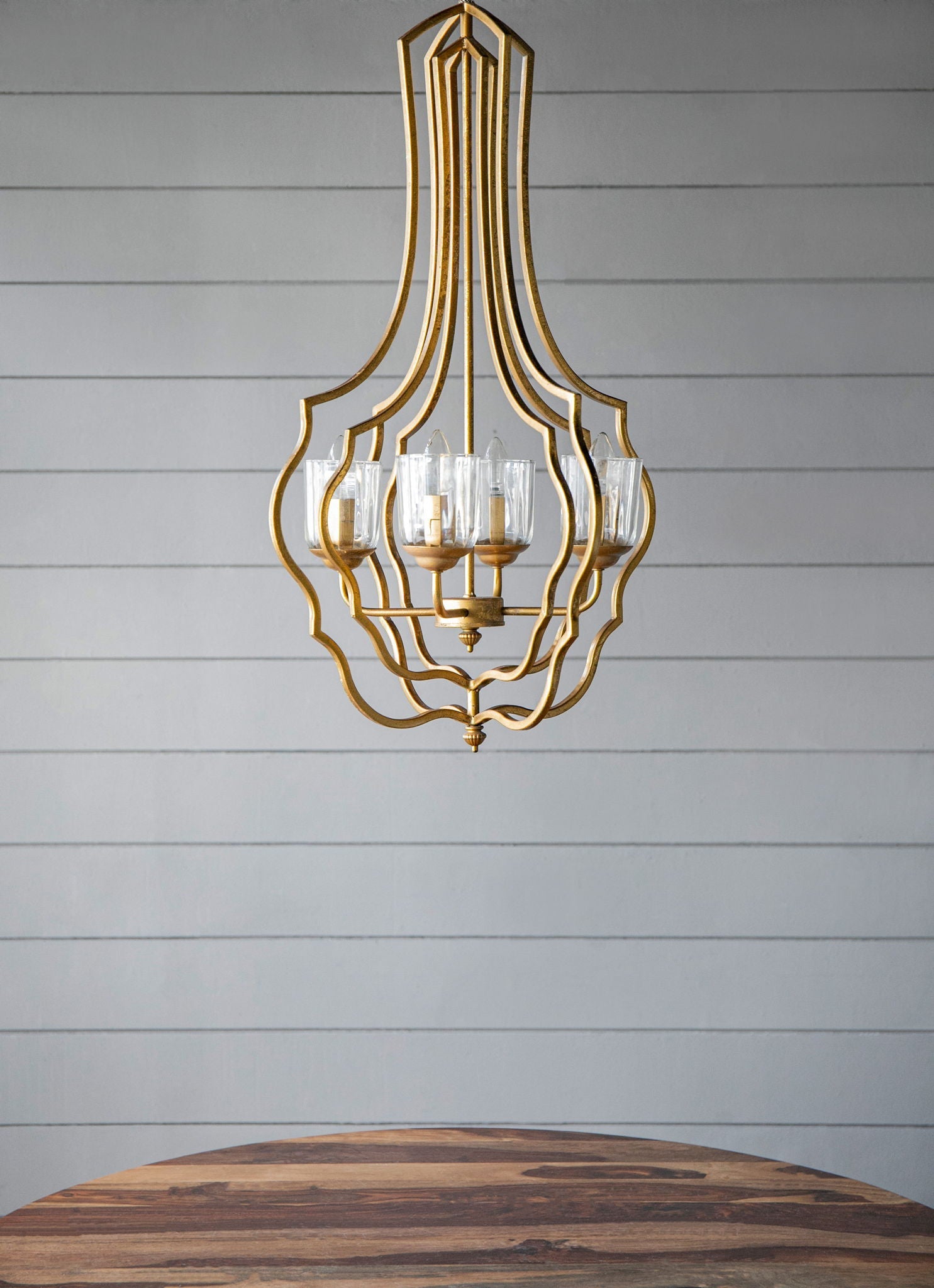 4-light gold metal chandelier with curved open-frame and glass cup holders, adjustable chain on Tampa Home & Garden Store