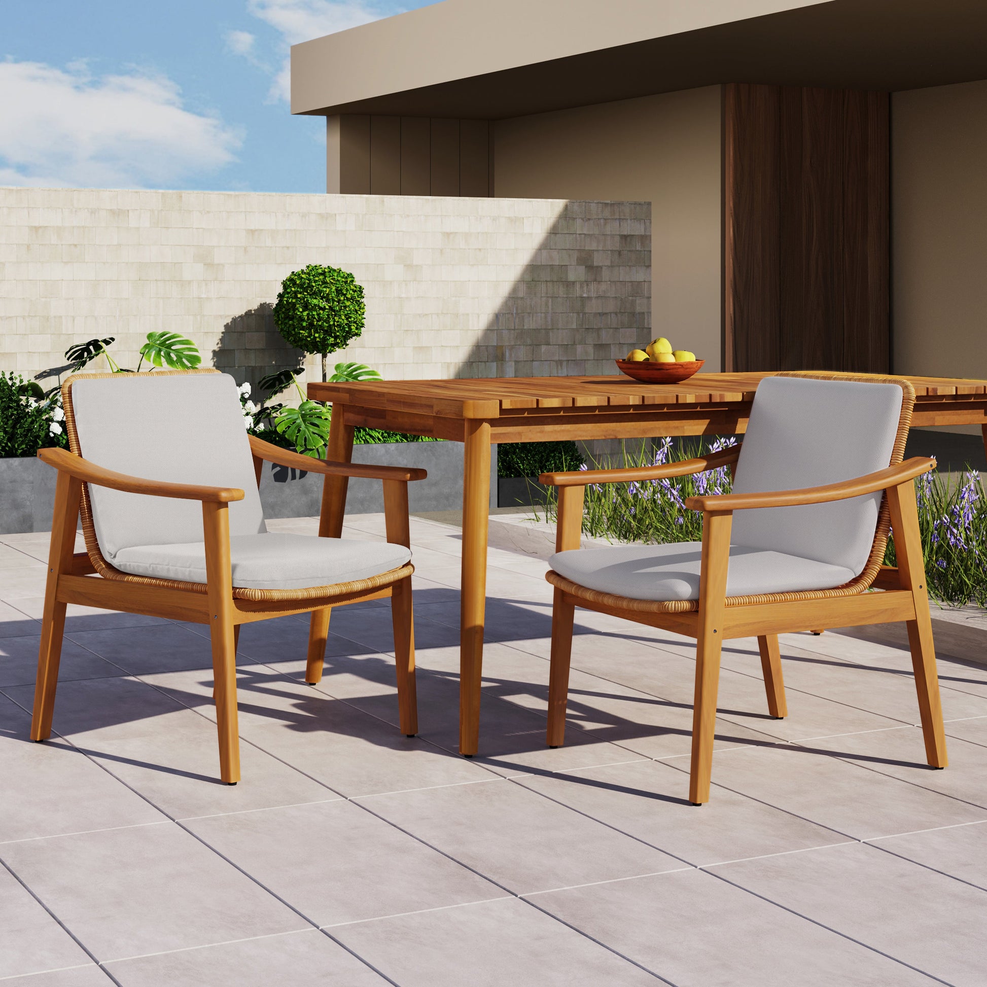 Outdoor dining chairs set of 2 in teak-colored acacia wood frame with gray cushions on Tampa Home & Garden Store