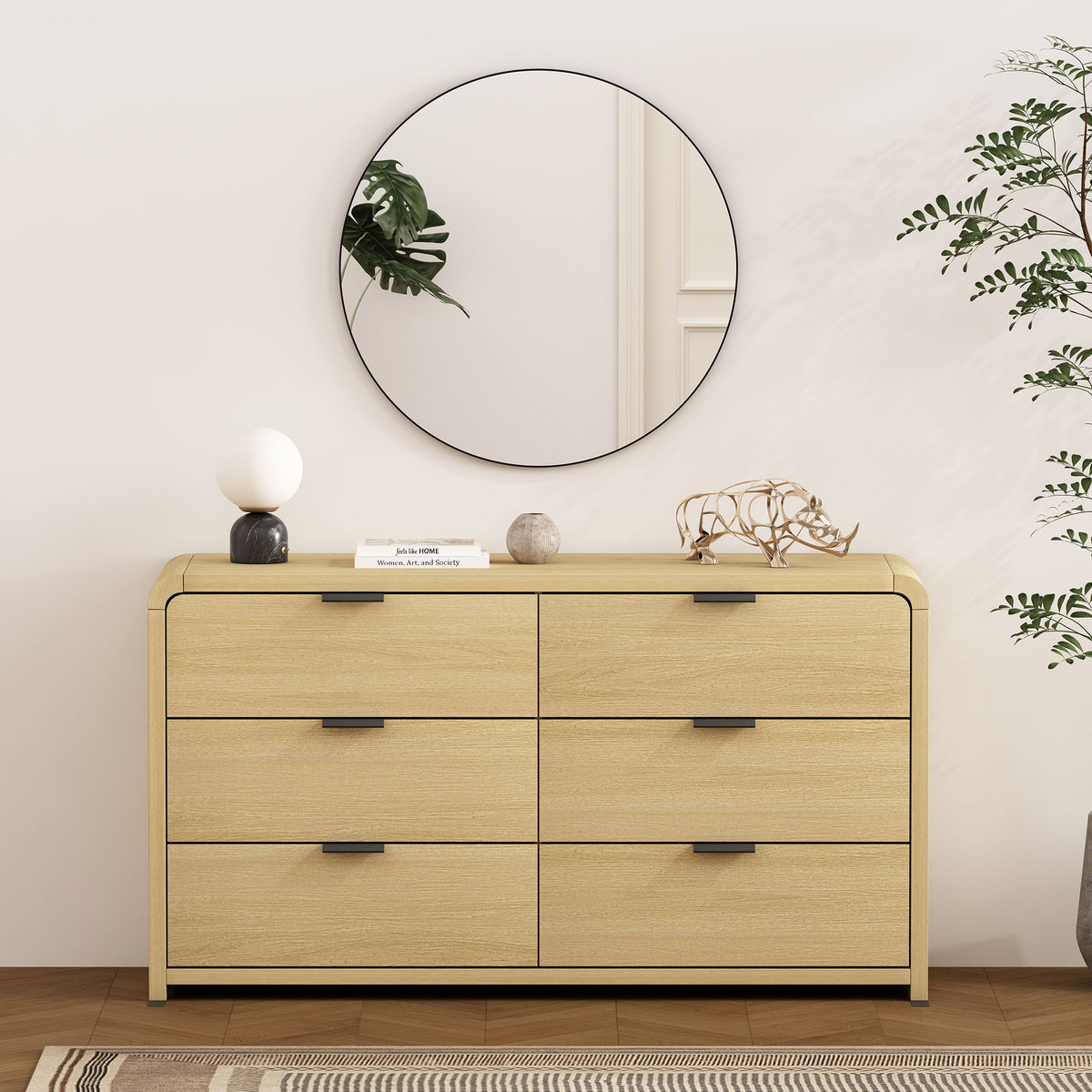 Oak dresser with 6 drawers in light finish, black handles, round mirror and greenery on Tampa Home & Garden Store
