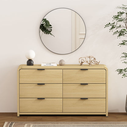 Oak dresser with 6 drawers in light finish, black handles, round mirror and greenery on Tampa Home & Garden Store