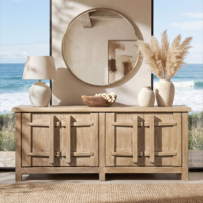 Natural wood four-door sideboard with carved handles, round brass mirror and beige decor on Tampa Home & Garden Store